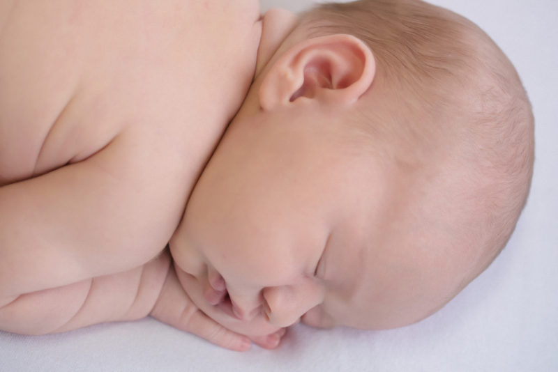 side profile of sleeping newborn baby | newborn photography san diego | www.babiesandbeauties.com to book today!